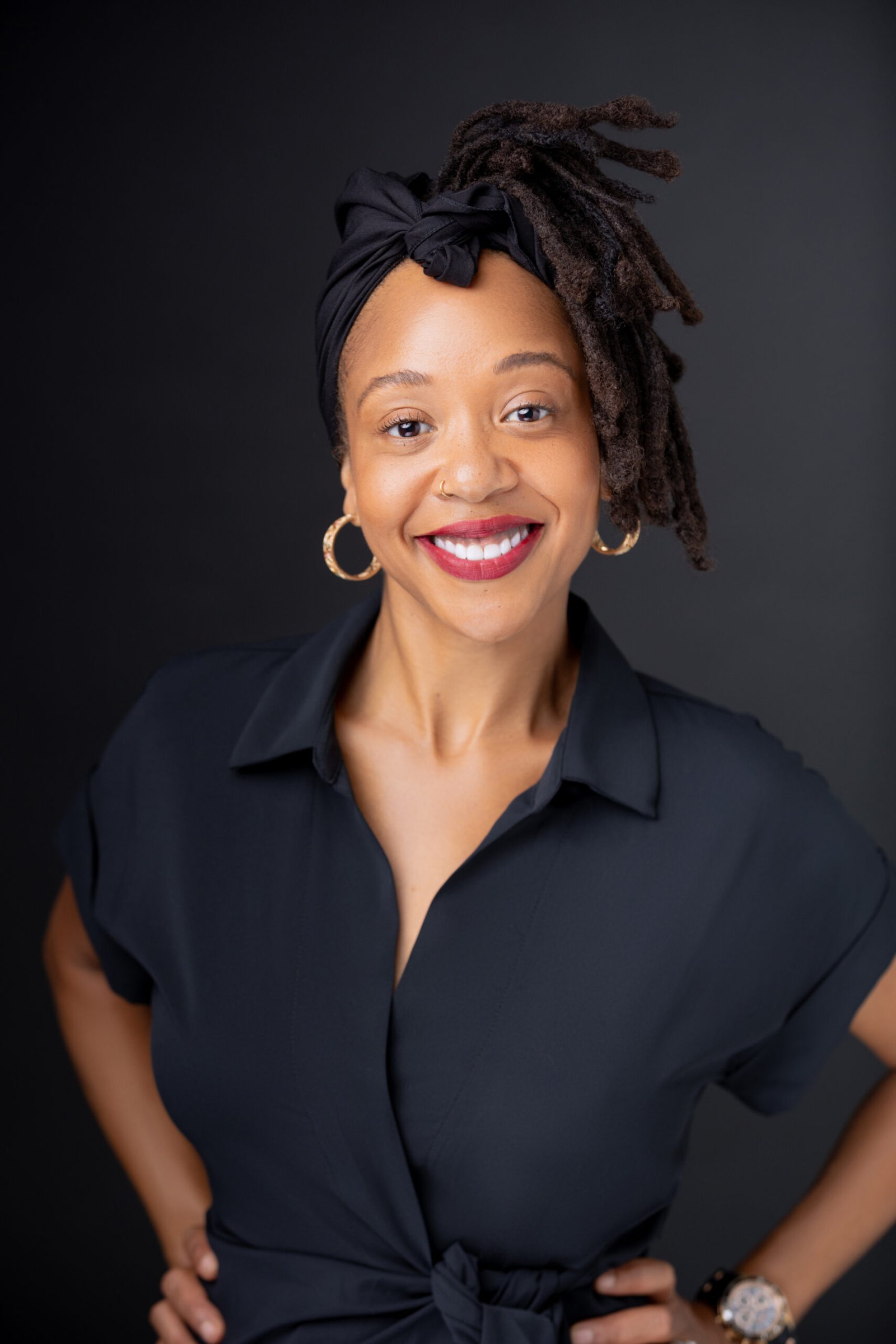 portrait of Tinisha Gold in black dress and hair